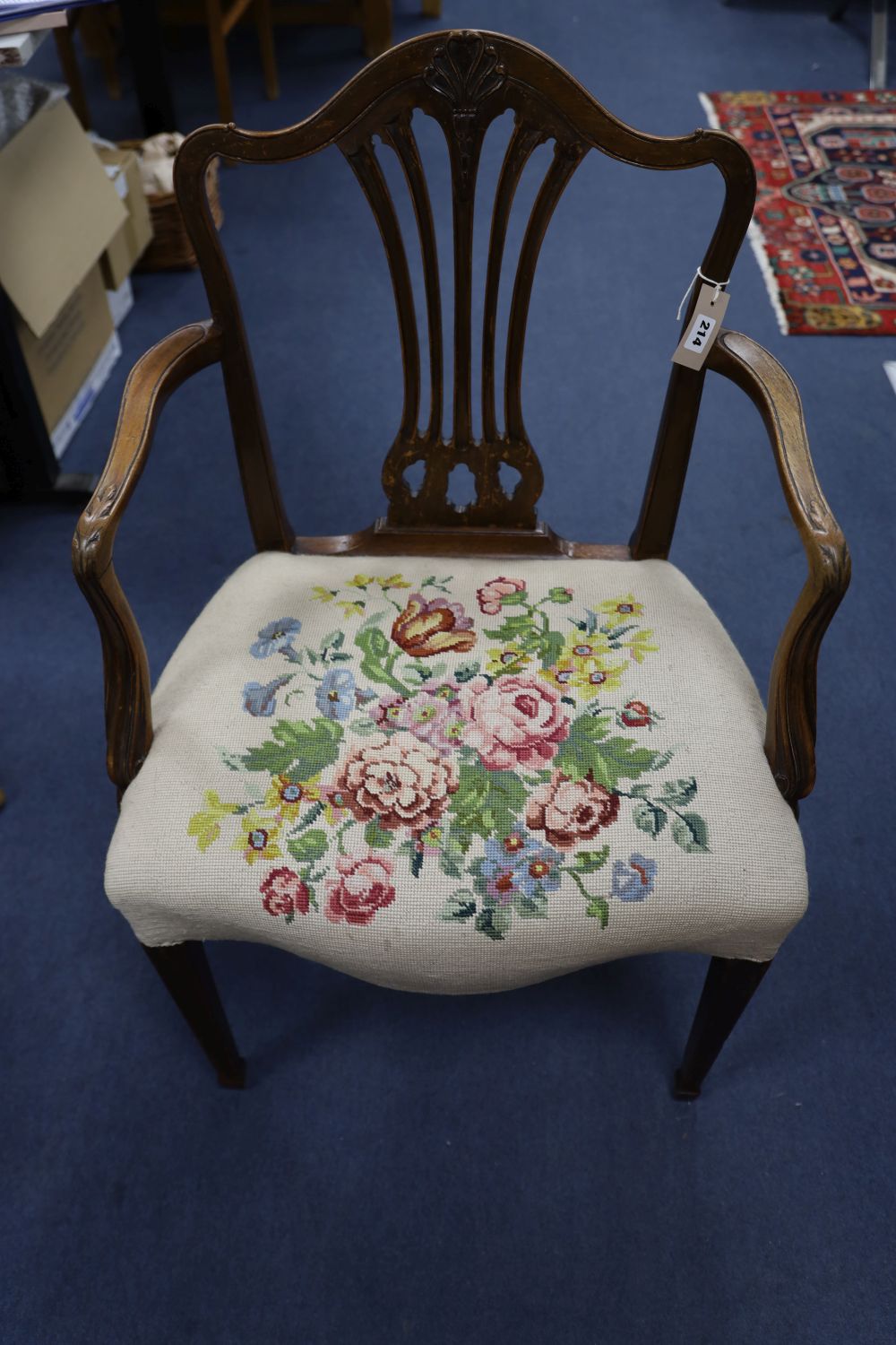 A pair of Hepplewhite style mahogany open armchairs